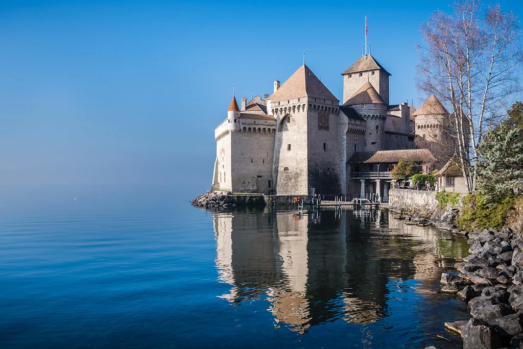 Venue view: Château de Chillon on Lake Geneva near Montreux, seen with its lakeside reflections.