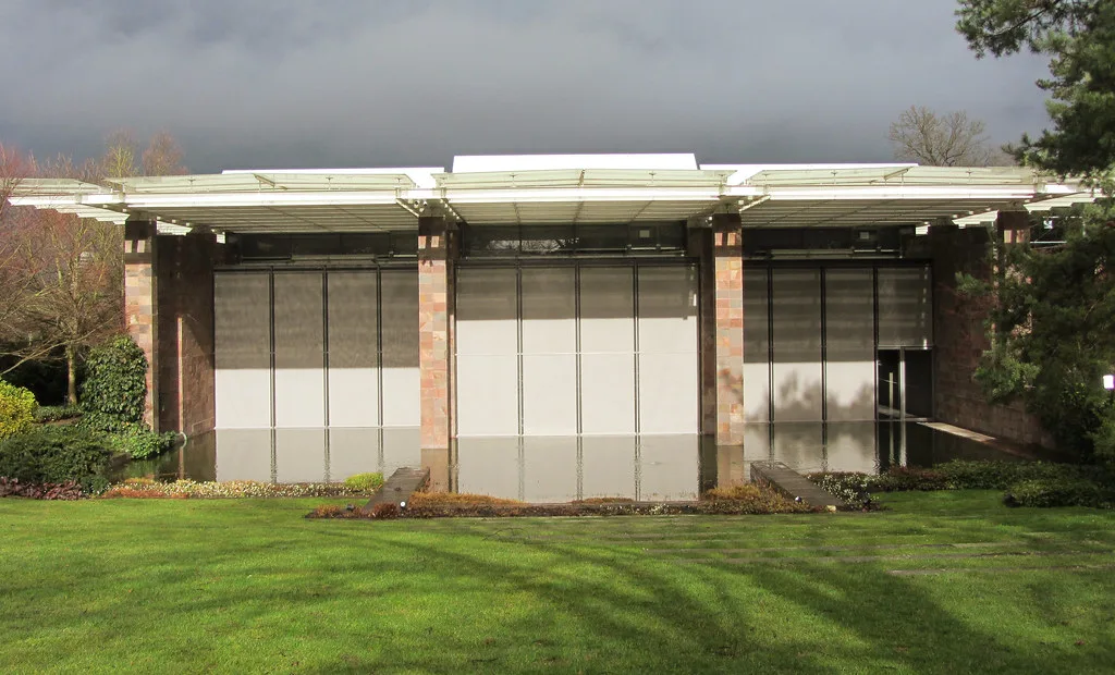 Venue view: Fondation Beyeler museum building by Renzo Piano, reflected in its water pool in Riehen near Basel.