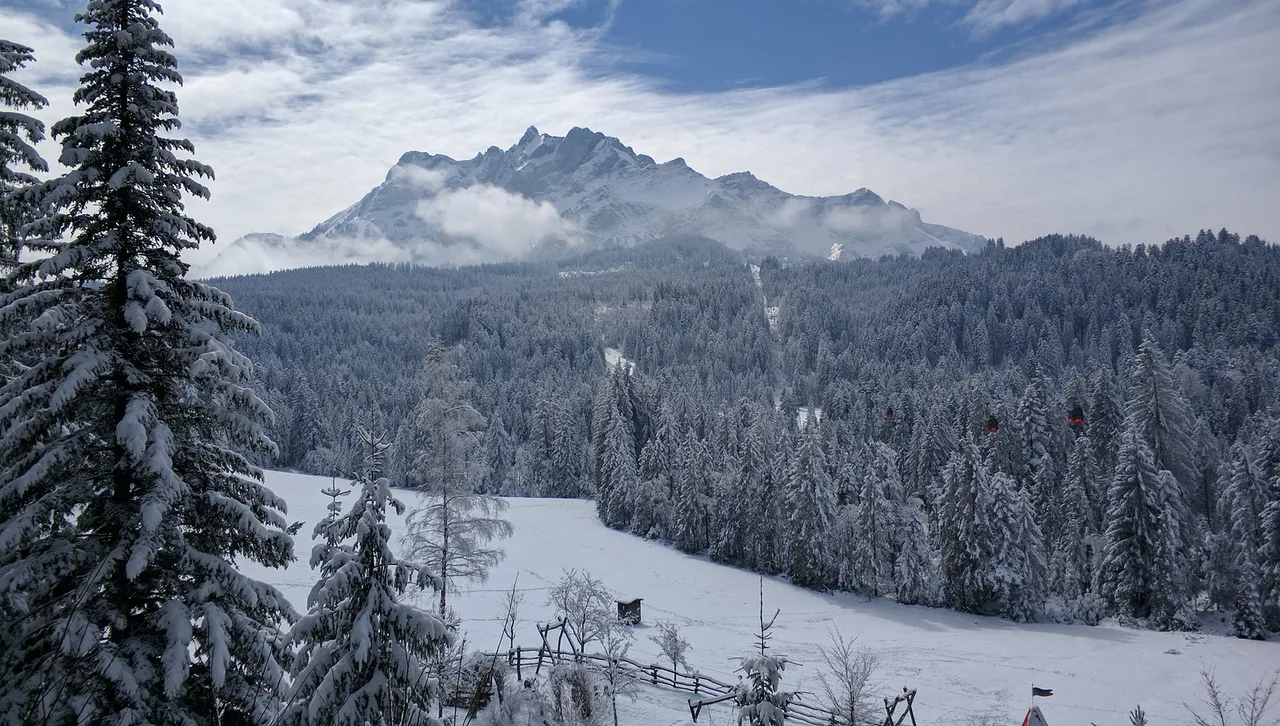 Venue view: Mount Pilatus, with red cable cars climbing toward the summit above Krienseregg near Lucerne.